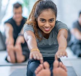 Yoga-pose-girl-touching-feet