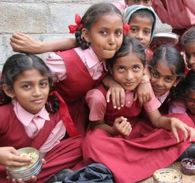 School girls eating