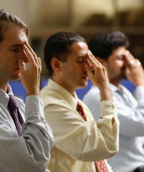 Corporate people doing Nadi Shodan Pranayama