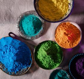 Different colours kept on bowls for playing Holi