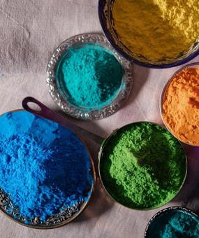 Different colours kept on bowls for playing Holi