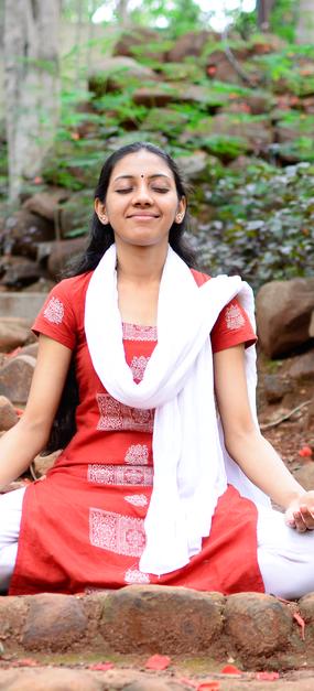 Meditation - Smiling Ekta meditating on the pathway in Ashram