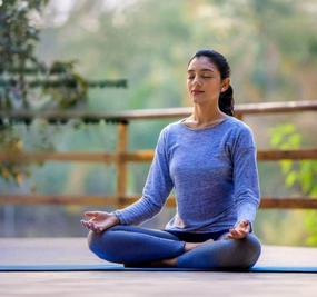 benefits of meditation - girl meditating at blr ashram