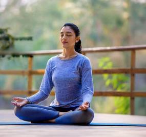 benefits of meditation - girl meditating at blr ashram