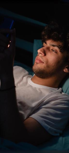 Meditation to break bad habits man scrolling on mobile while sleeping