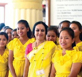 Bhanu didi with north-east girls all dressed in yellow