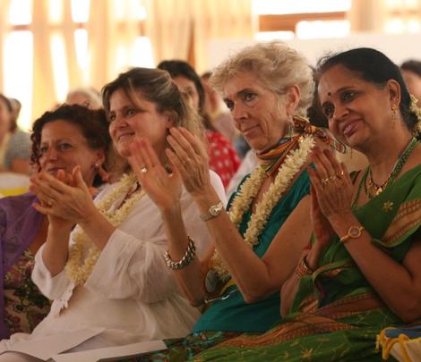 Post spiritual practices females smiling & clapping Iwc