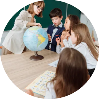 Teacher guiding four attentive children at a table, emphasizing life skills through ART Excel.