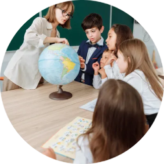 Teacher guiding four attentive children at a table, emphasizing life skills through ART Excel.