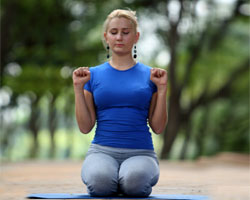 Sit in Vajrasan. Get ready for Bhastrika yoga breathing technique.